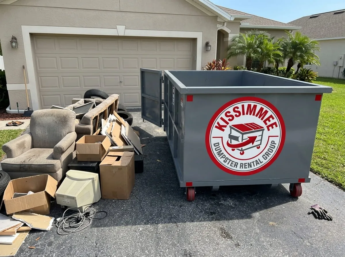 Household junk and furniture loaded into a roll-off dumpster in Kissimmee, Florida